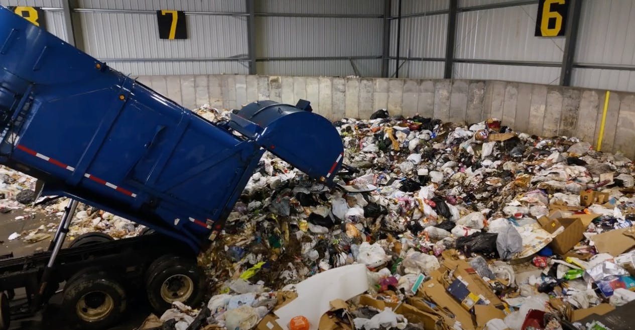 Truck dumping trash ready for gnufox sorting